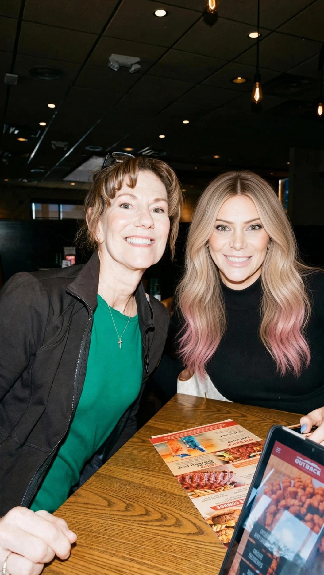 Margaret, right, with champagne blonde hair and subtle pink ends, and her mom Maryellen, left, founders of Metallic Media Group